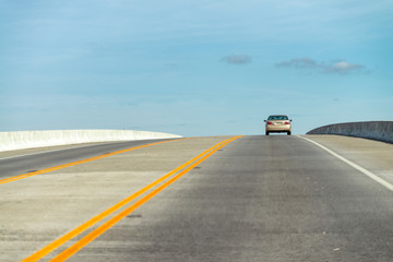 Moving car on seven mile bridge landscape of Florida Keys water; atlantic ocean