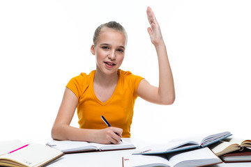Educational Ideas. Portrait of Smiling Caucasian Teenager Girl Posing with Books and Lifted Hand....
