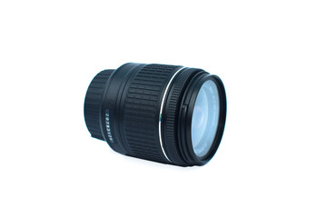 Close up of a black color camera lens of a digital camera placed over a white background