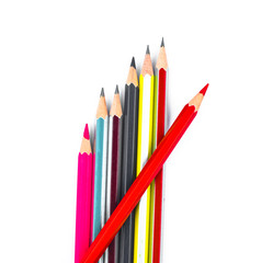 Bunch of different colored wood pencil crayon placed on a white background