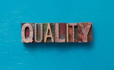 Quality word written with wood type blocks
