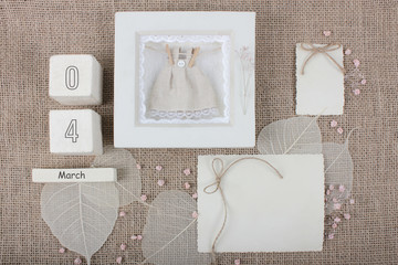 Calendar. March 4th. Wood cube calendar with date of month and day. Newborn postcard concept for...