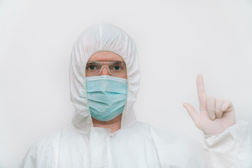 Portrait of a specialist in blue respirator and protective coverall