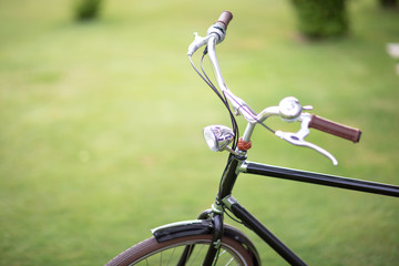 Classic steel bicycle on green grass