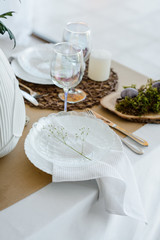 Easter festive elegant home table setting decor, decorated table for traditional holiday dinner, decorated with spring flowers, Easter decor, white napkins and eggs