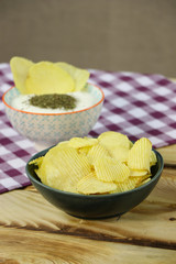 Chips and yogurt mint dip sauce in a bowl
