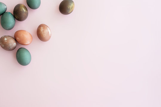 Set of painted eggs onpink   backround, copy space. Natural pastel colorful egg. Happy easter and holiday  concept.