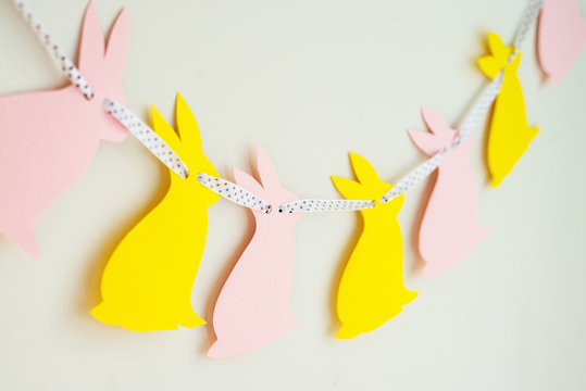 Easter Bunny Banner. Cute Bunny Shapes With Yarn Pom Pom Tails.