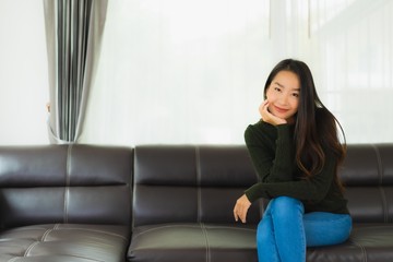 Obraz premium Beautiful portrait young asian woman sit relax on sofa