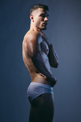 Athletic man with a muscular body-builded bodybuilder