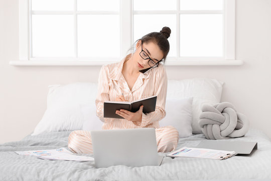 Beautiful Young Woman Working At Home