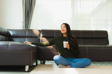 Portrait beautiful young asian woman use smart mobile phone with coffee cup