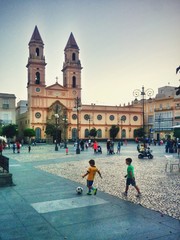 Children Playing In Town Square