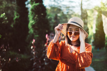Portrait of beautiful asian woman standing at garden in the morning