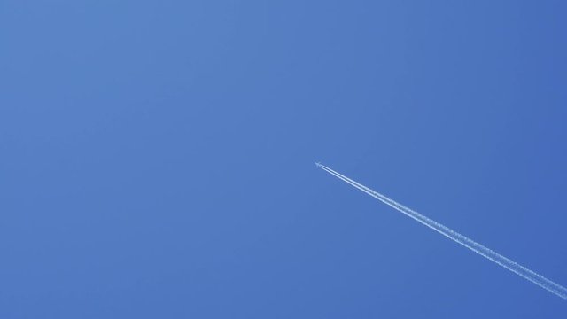 blue sky and airplane moving high