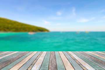 Wood table top with blurred nature scene tropical beach