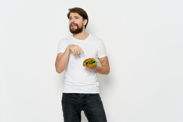 young man holding an orange