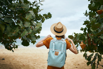 young man holding a basket of apples
