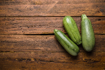 Top view fresh organic zucchini squash on table top