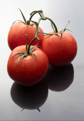 red tomatoes on a black