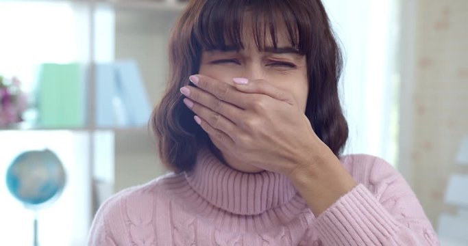 Young woman closed her nose and mouth when feels stink