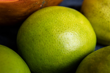 Macro photography to a fresh Green lemon. Fruit and texture concept 