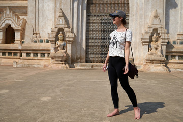 A woman tourist and the Ananda Temple in the old Bagan, Myanmar, Burma.