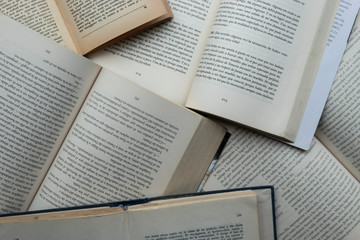 Fototapeta premium Top view of a multiple old literature books in spanish. 