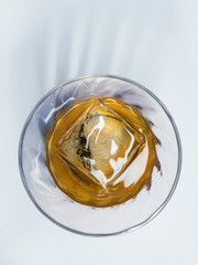 glass of whiskey on the rocks isolated on a white background
