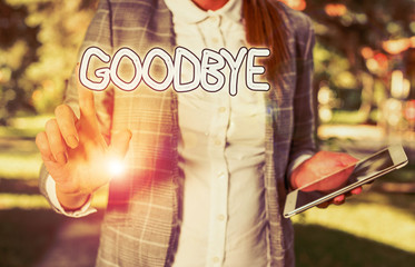 Conceptual hand writing showing Goodbye. Concept meaning used to express good wishes when parting...