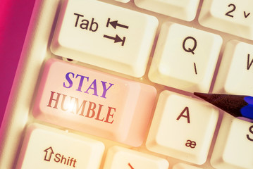 Writing note showing Stay Humble. Business concept for not proud or arrogant Modest to be humble...