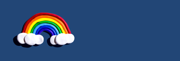 Rainbow and white clouds made with clay - overhead view