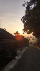 Sunrise in the countryside in Central Java Indonesia. people's homes, village roads and sunny sunshine