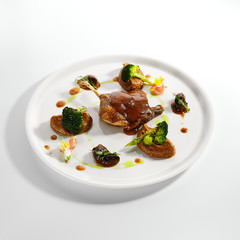 Confit duck leg with vegetables