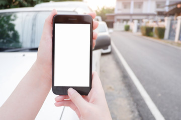 Cropped shot view of business human’s hands holding the mobile phone with blank copy space screen for your information content or text message, the woman reading text message on the smart phone during
