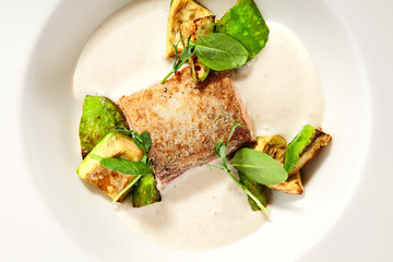 Salmon fillet with baked avocado