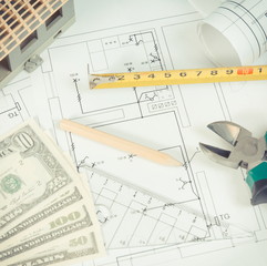 Electrical diagrams, work tools for engineer jobs, small house and currencies dollar, building home cost concept