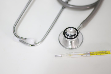 Stethoscope isolated equipment on white texture with blurred background