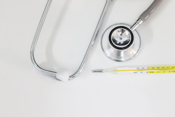 Stethoscope isolated equipment on white texture with blurred background