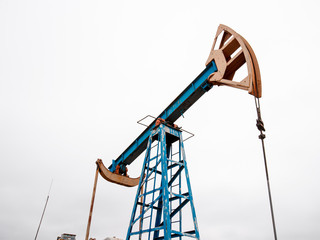 Green Oil pump oil rig energy industrial machine for petroleum crude. oil crisis. Russia pumps oil pollution.