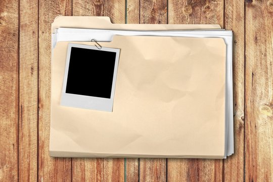 File folder with documents and blank install photo frame