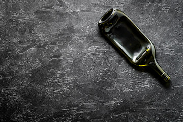 Wine bottle on black background top view copy space