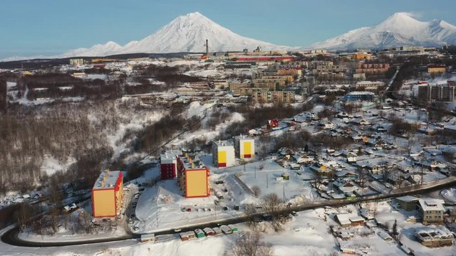 Kamchatka's home volcanoes tower over the city of Petropavlovsk-Kamchatsky. Taken in winter from a quadrocopter