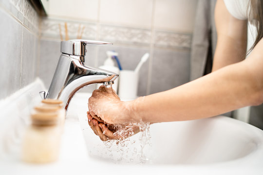 Woman Washing Hands With Soap And Water In Clean Bathroom.Decontamination Protocol,hand Hygiene Routine.Cleaning Hands Regularly.Infectious Disease Prevention/protection.Handwashing Disinfection