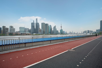 Fototapeta na wymiar Road and modern architecture in Shanghai
