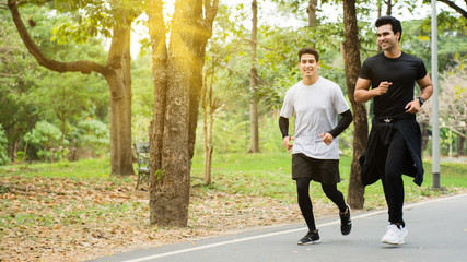 Two men jogging in the morning at the park