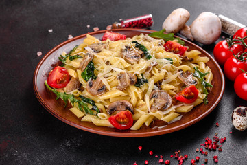 Pasta with mushrooms, cheese, spinach, rukkola and cherry tomatoes