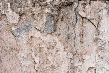 Texture of a concrete wall with cracks and scratches which can be used as a background