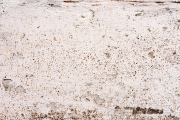 Texture of a concrete wall with cracks and scratches which can be used as a background