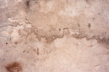 Texture of a concrete wall with cracks and scratches which can be used as a background